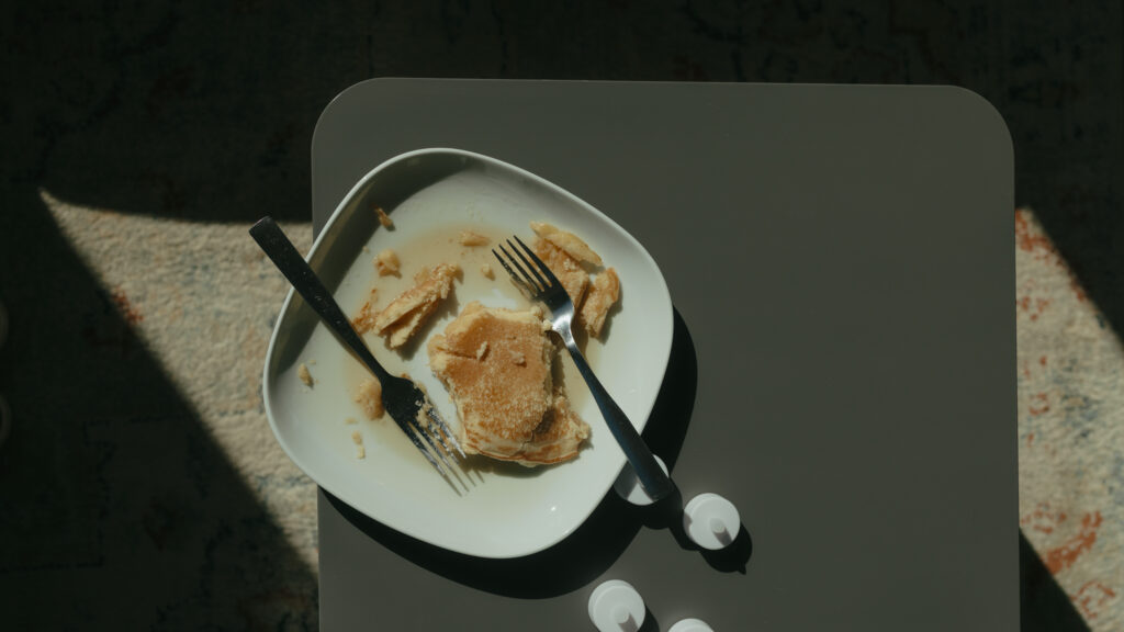 Bride and groom's half eaten pancakes sitting on the table