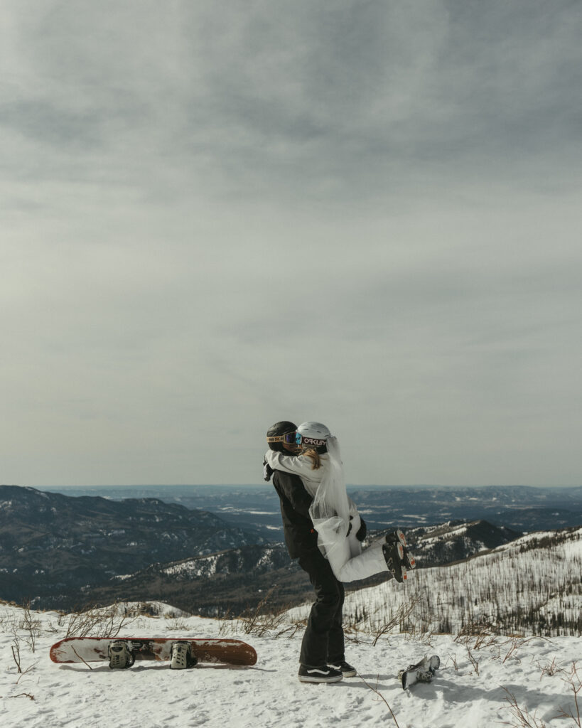 Bride and Groom on elopement day at the top of the ski mountain spinning around in Pagosa Springs, Colorado
