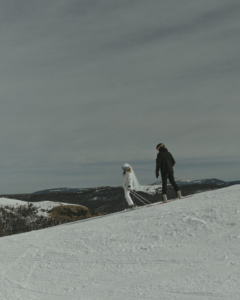 Bride and Groom Eloping while skiing down the mountain at Wolf Creek Ski area in Pagosa Springs, Colorado