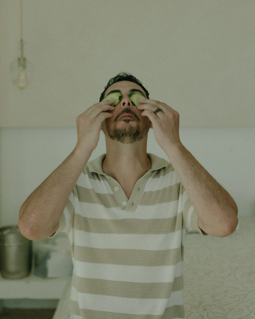 groom getting ready candid skincare moment destination wedding Mexico groom preparation