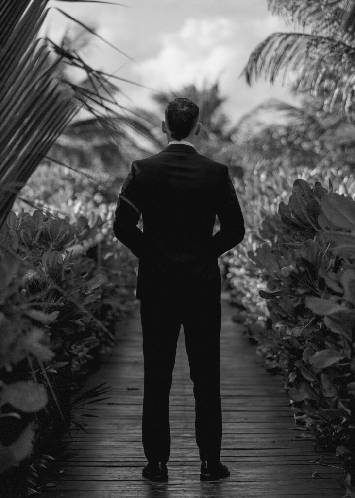 groom waiting before ceremony tropical destination wedding Mexico emotional anticipation moment