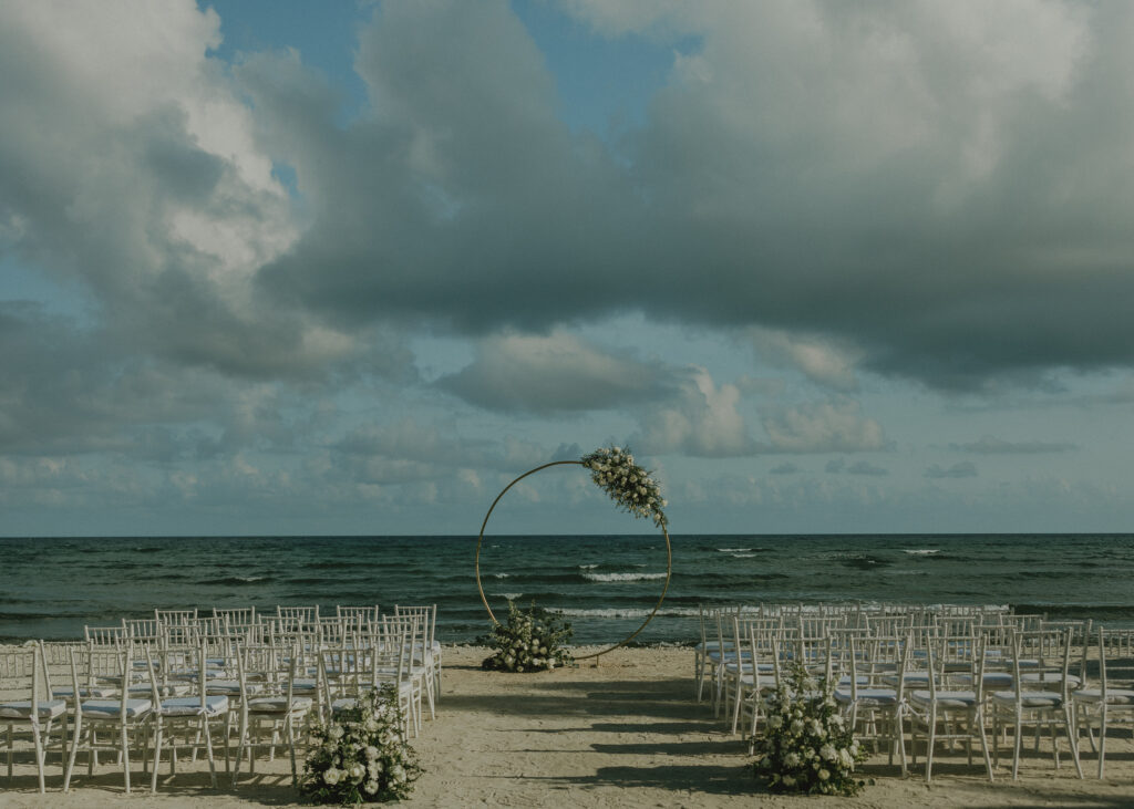 destination wedding ceremony arch on beach Cancun Mexico with ocean view