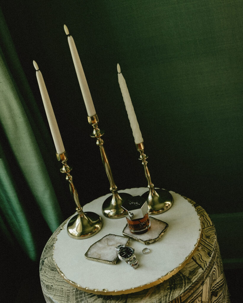 Wedding ring and detail styling with candles and glass decor at Trinity View Farm wedding