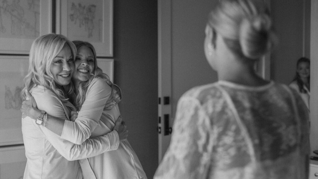 Emotional getting ready moment with bride, mother, mother-in-law and bridesmaid at Trinity View Farm wedding in Franklin TN