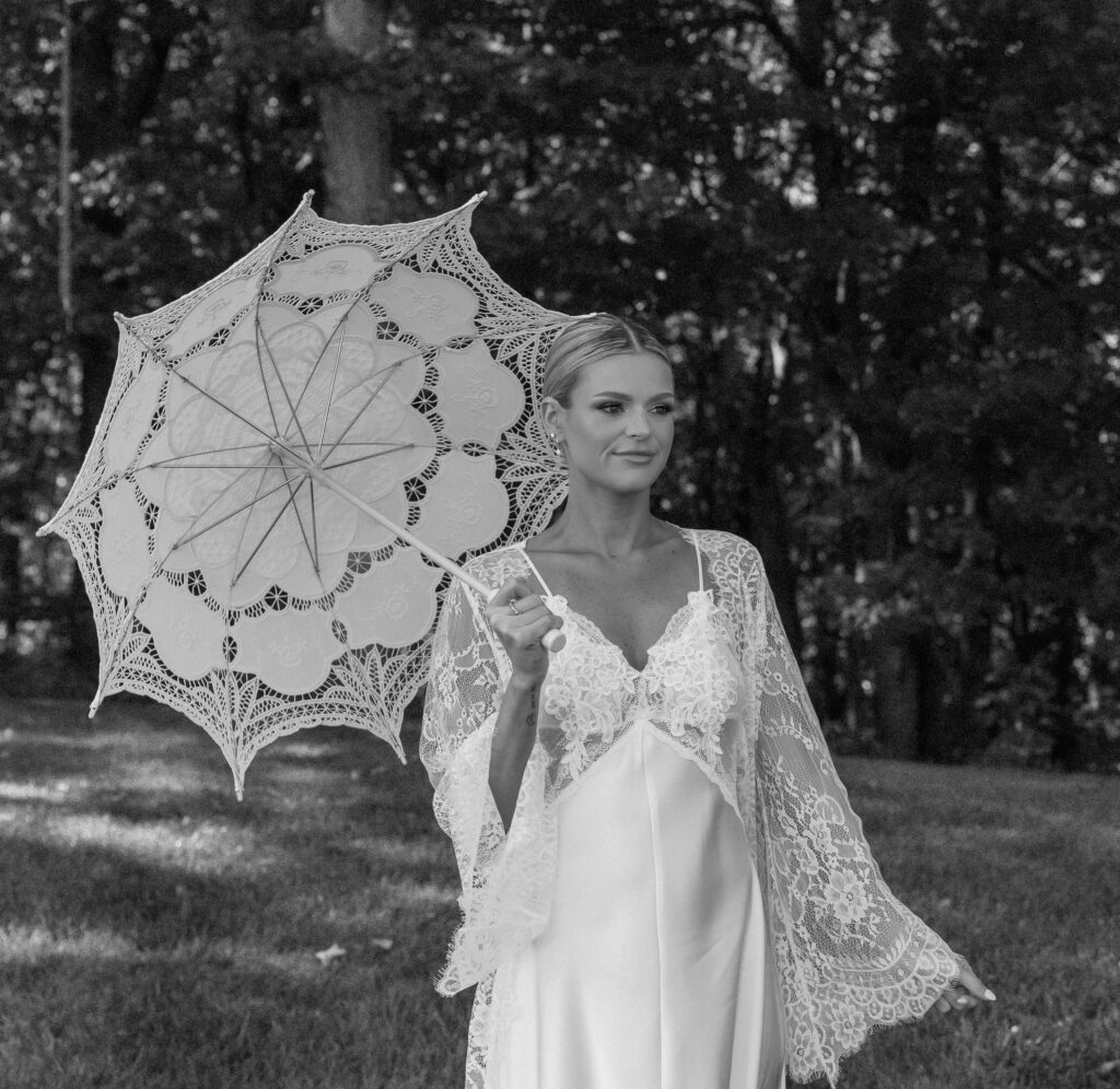 Bride holding lace parasol during bridal portraits at Trinity View Farm in Franklin TN