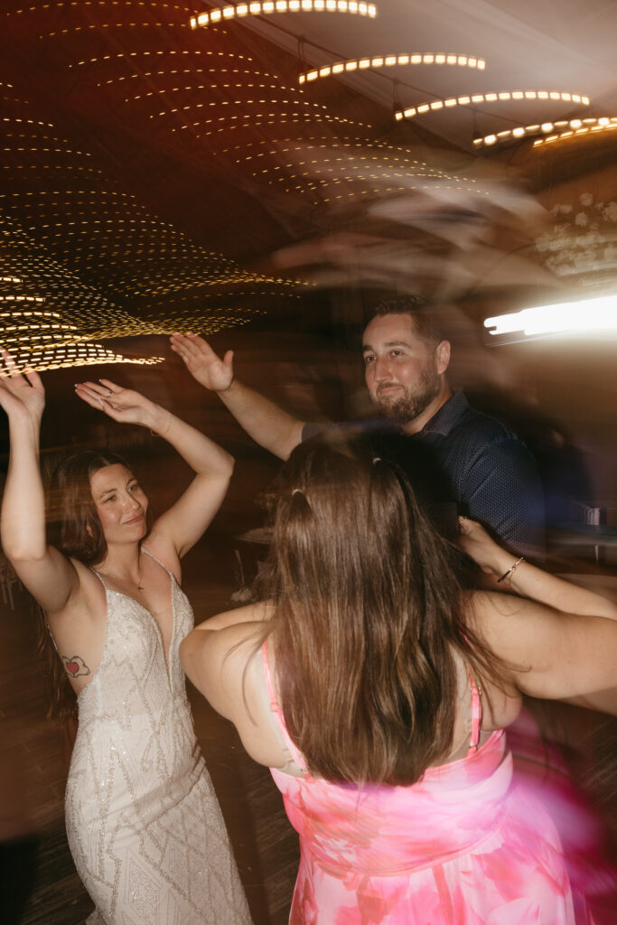 wedding reception dance floor motion blur energetic party destination wedding Mexico