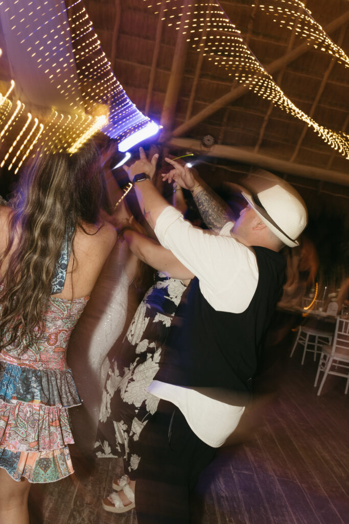 guests dancing wedding reception party tropical destination wedding Mexico fun candid moment
