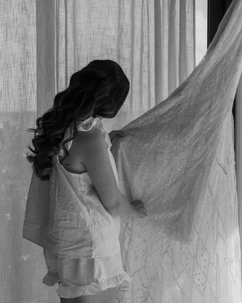 bride getting ready wedding morning putting on dress destination wedding Mexico bridal details