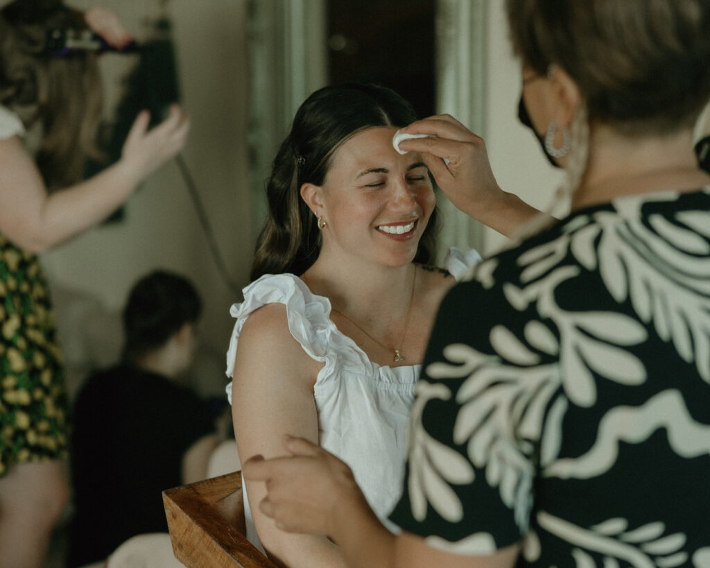 bride getting ready candid makeup touch up destination wedding Mexico bridal prep moments
