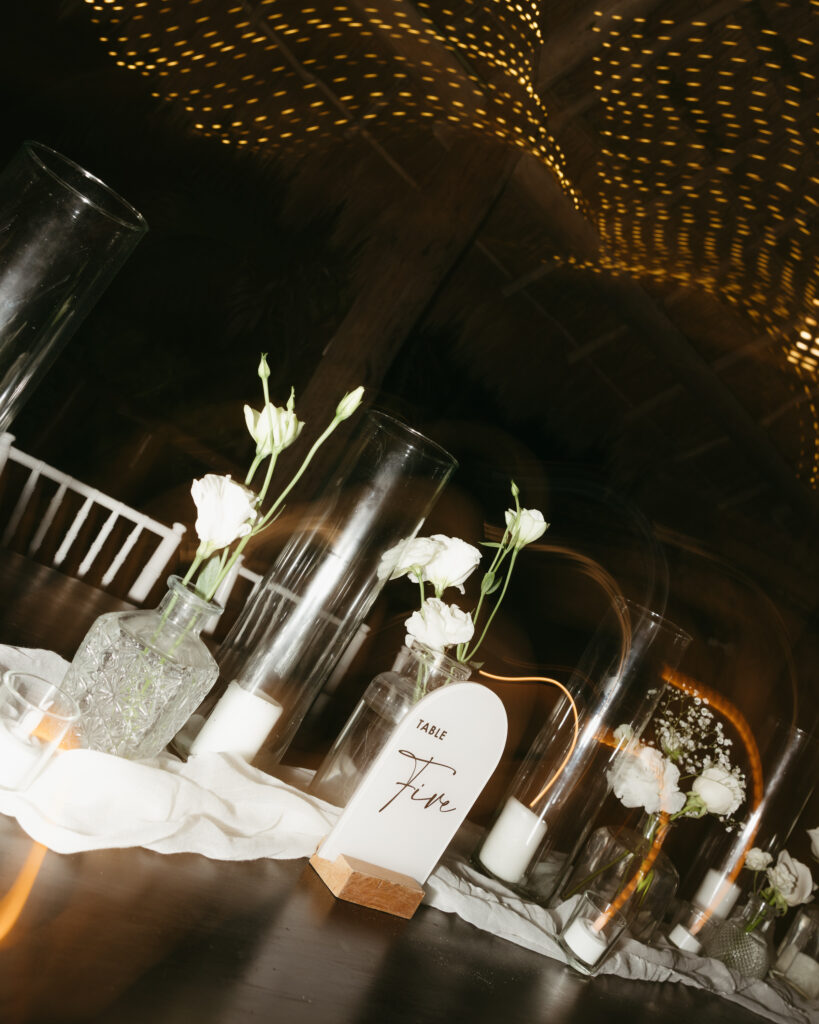 wedding reception decor candles and florals moody detail destination wedding Mexico evening