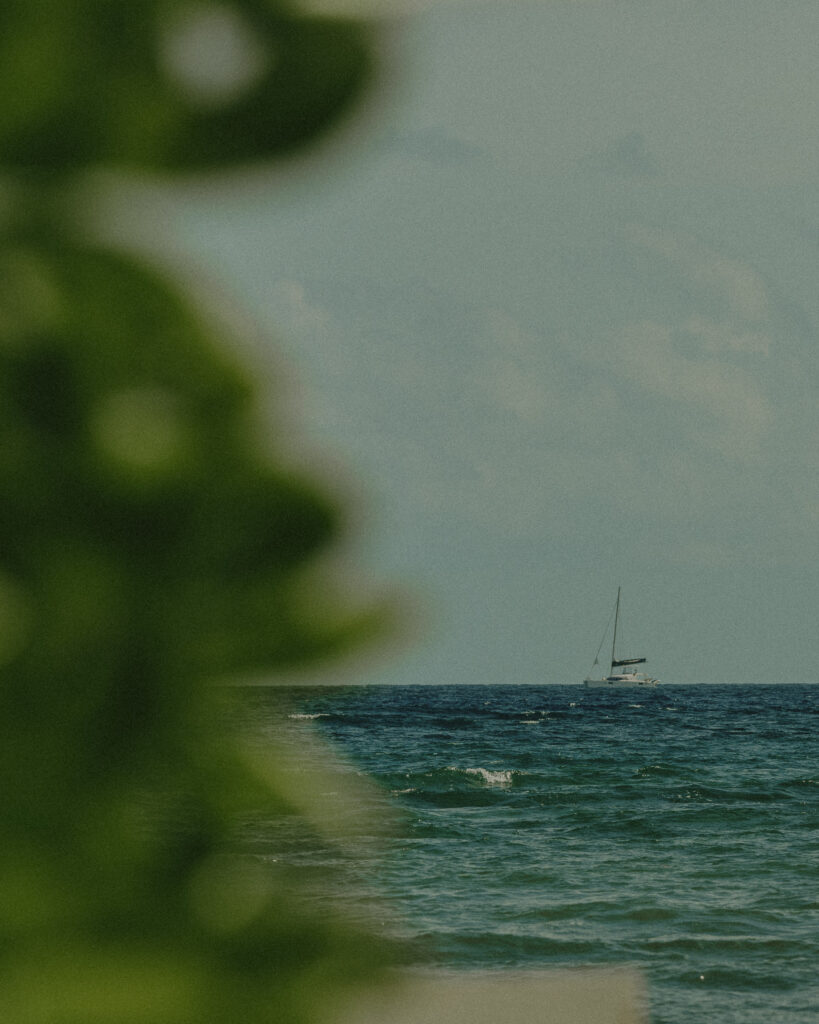 sailboat on ocean Cancun Mexico beach wedding destination view