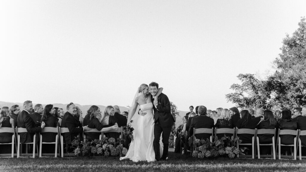 Bride and groom walking down aisle together after ceremony at Trinity View Farm wedding in Franklin Tennessee