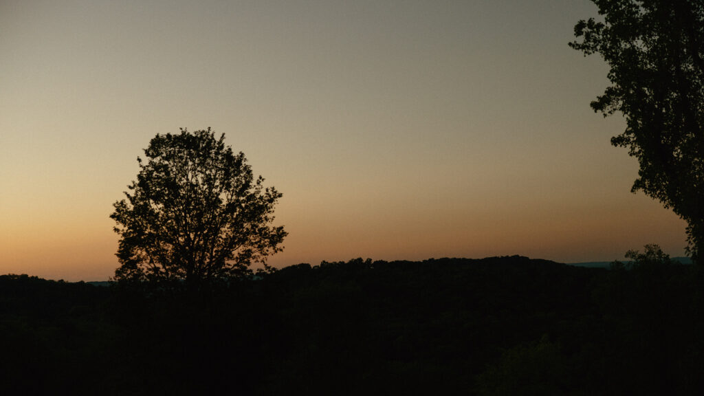 Sunset over rolling hills at Trinity View Farm wedding in Franklin Tennessee
