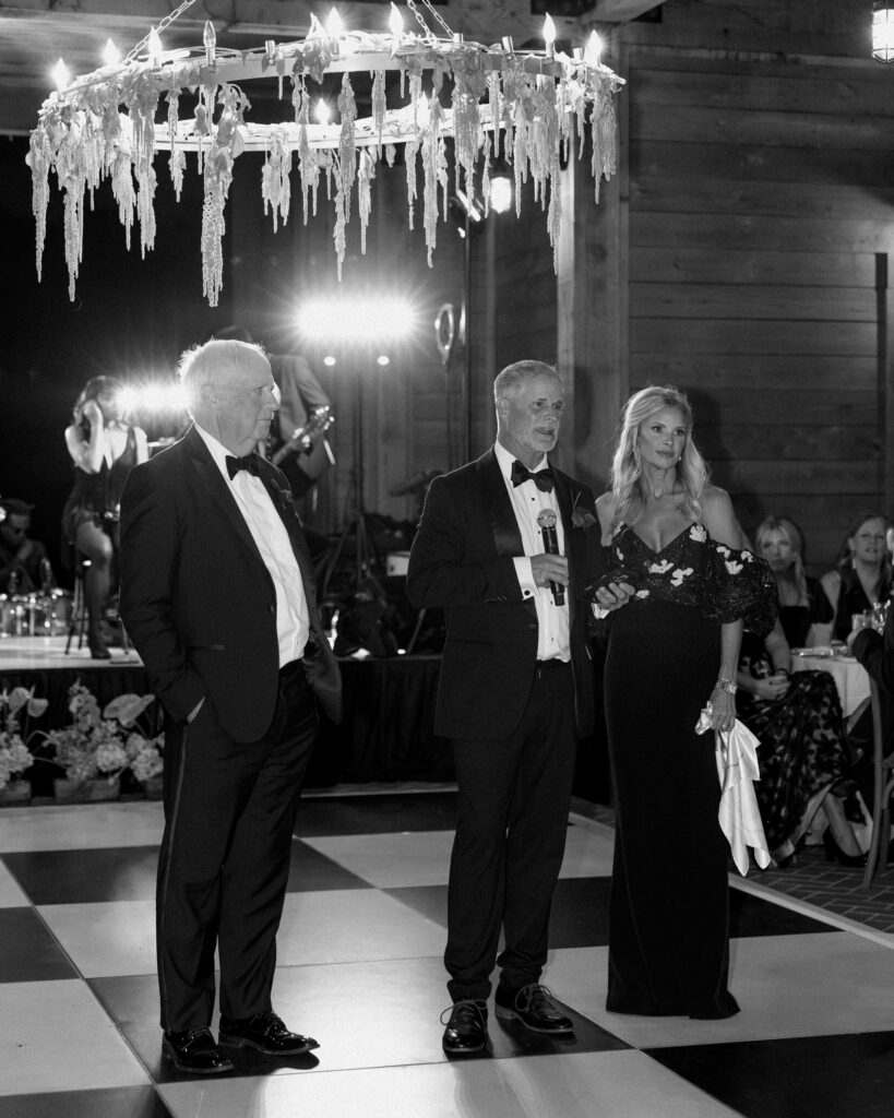 Parents of the bride standing during reception speeches at Franklin Tennessee wedding venue