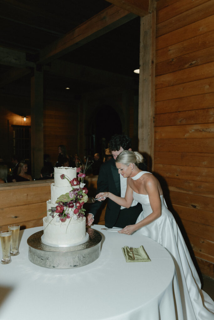 Wedding cake with floral design displayed at reception in Franklin Tennessee
