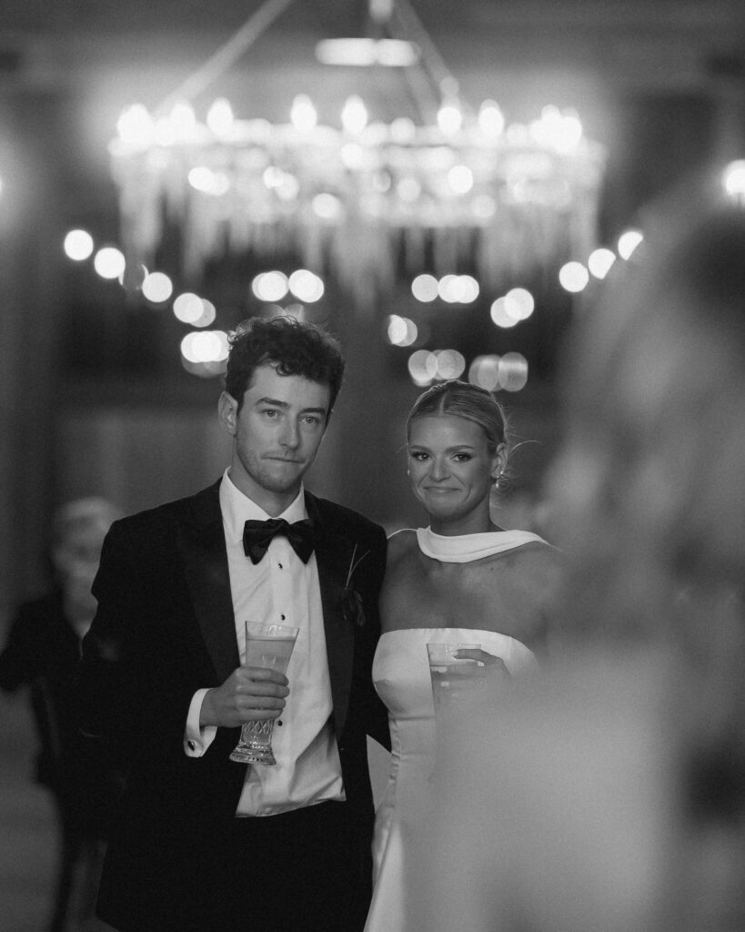 Bride and groom standing together with drinks during reception in Franklin Tennessee