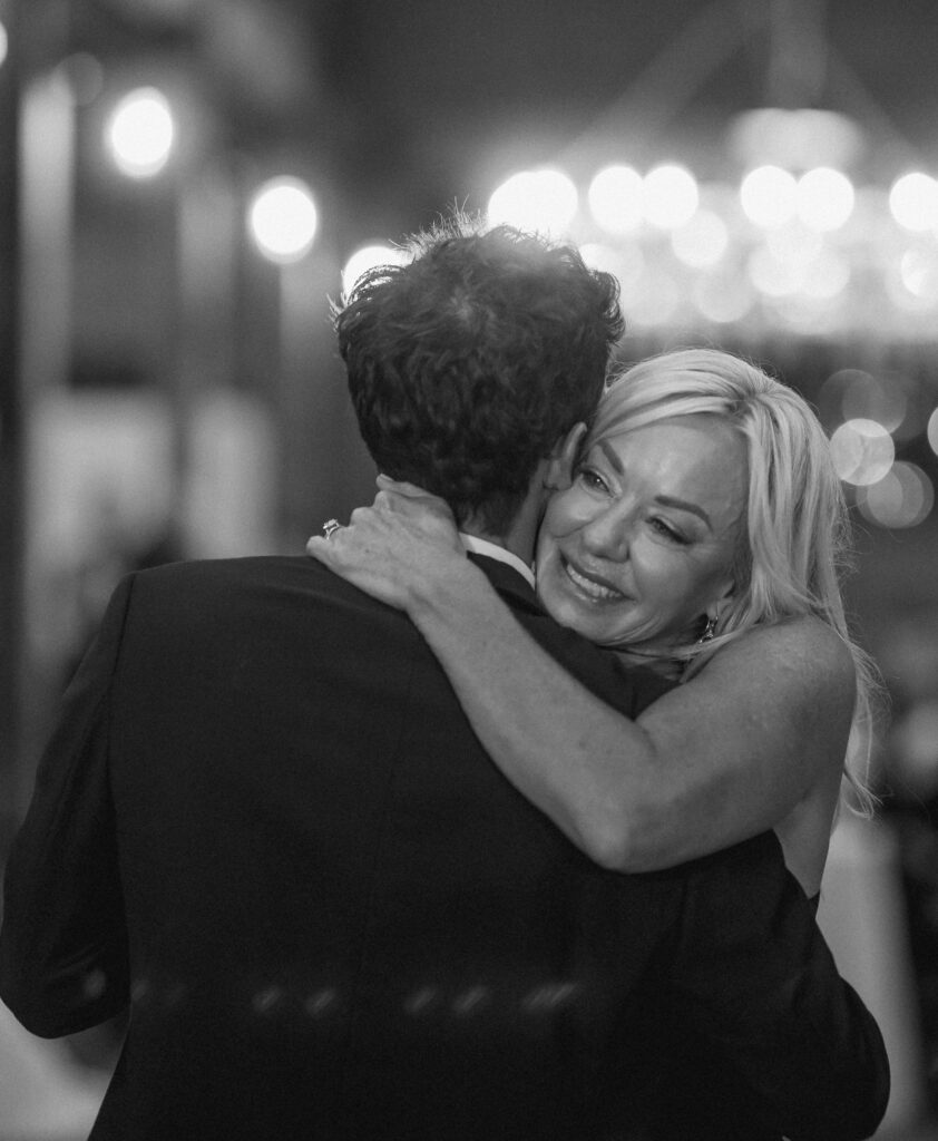 Mother embracing groom during emotional reception moment in Franklin Tennessee