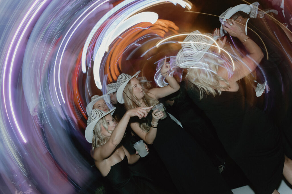 Guests dancing with motion blur lights during high energy wedding reception in Franklin TN