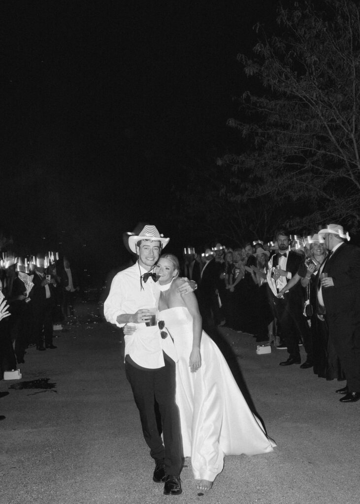 Bride and groom walking through guests during wedding exit at Trinity View Farm in Franklin TN