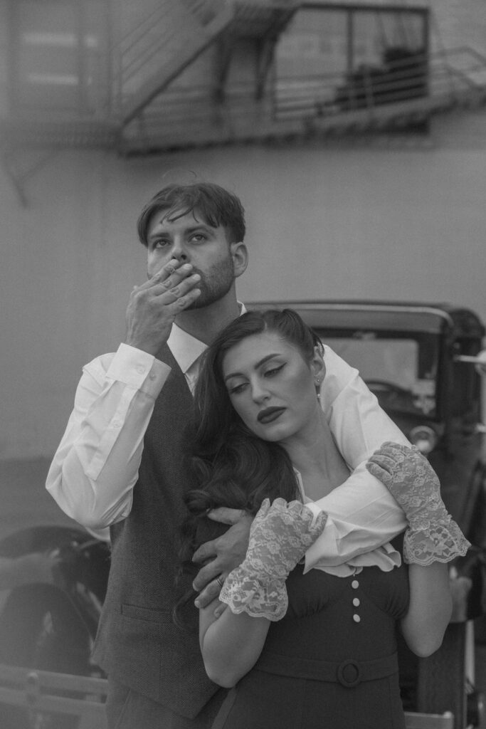 moody black and white couples portrait Peaky Blinders inspired engagement session Texas