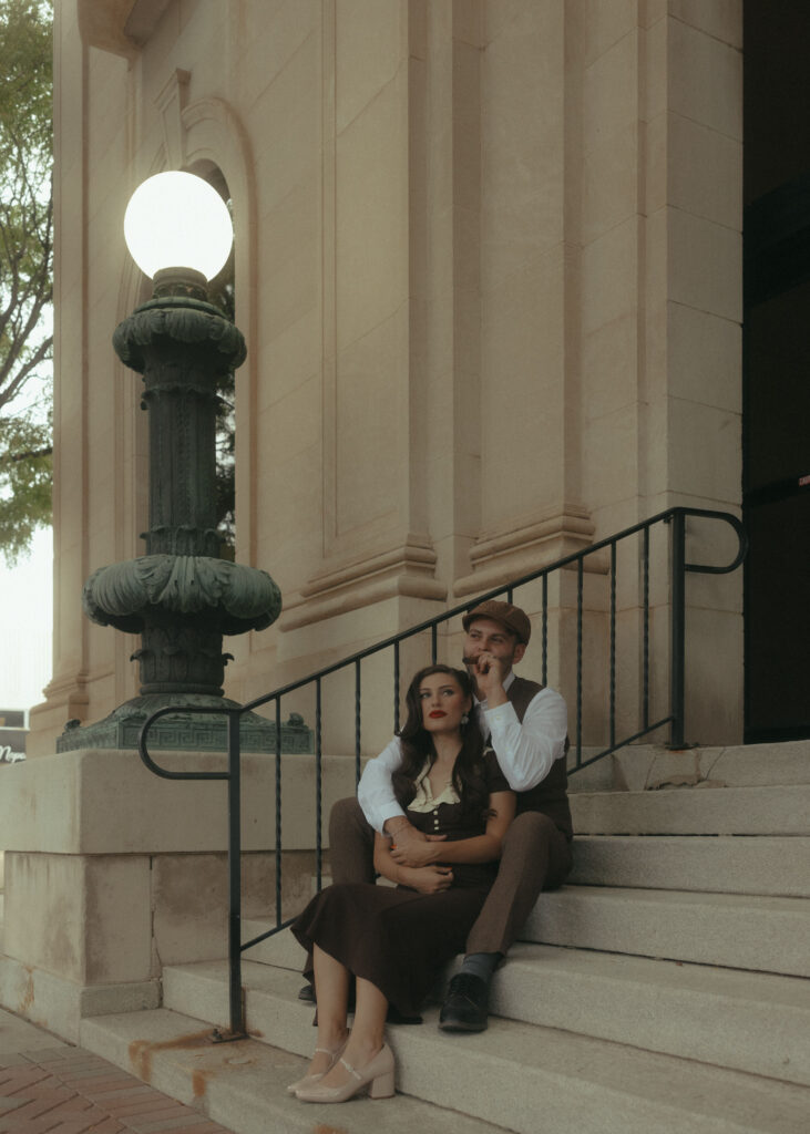 cinematic couples photo on historic building steps Amarillo Texas engagement photographer