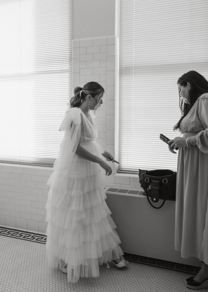 bride with friend preparing before courthouse wedding amarillo texas